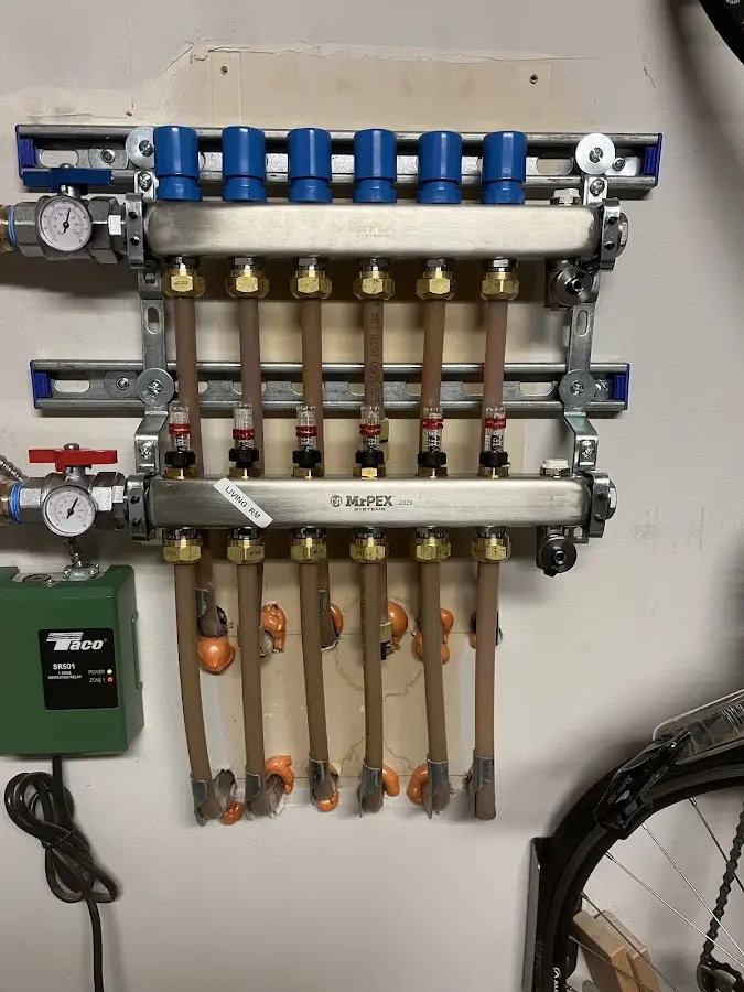 Plumber performing Water Heater Repair at a residential property in Marshall